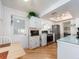 Bright kitchen featuring white cabinetry, stainless steel appliances, and modern finishes at 8622 140Th Way, Seminole, FL 33776