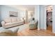 Bright living room with hardwood floors, light walls, and a closet with storage in the background at 8622 140Th Way, Seminole, FL 33776