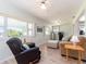 Comfortable living room featuring a sofa, recliner, ottoman and large windows at 8622 140Th Way, Seminole, FL 33776