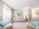 Bright living room with hardwood floors, light walls, comfortable seating and large window at 8622 140Th Way, Seminole, FL 33776