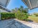 View from the shaded patio area with pavers looking out over the backyard at 8622 140Th Way, Seminole, FL 33776