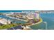 Aerial view featuring condos, boat docks, and waterfront property in a coastal community at 1 Key Capri # 604W, Treasure Island, FL 33706