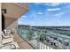 Relax on this condo balcony with water views and comfortable seating, perfect for enjoying the scenery at 1 Key Capri # 604W, Treasure Island, FL 33706