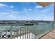 Enjoy breathtaking marina views from this spacious balcony with clear skies and boat docks at 1 Key Capri # 604W, Treasure Island, FL 33706