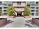 Building entrance with manicured landscaping at a condominium complex at 1 Key Capri # 604W, Treasure Island, FL 33706