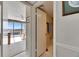 Hallway leading to a bright living room with scenic views and a glimpse into the bathroom at 1 Key Capri # 604W, Treasure Island, FL 33706