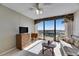 Inviting living room with a ceiling fan, dresser, and sliding doors with scenic views from the balcony at 1 Key Capri # 604W, Treasure Island, FL 33706
