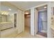 Full bathroom featuring a vanity with white cabinets and a shower with glass doors at 1 Key Capri # 604W, Treasure Island, FL 33706