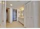 Well-lit bathroom with vanity, cabinet space, and shower at 1 Key Capri # 604W, Treasure Island, FL 33706