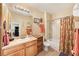 A full bath features a shower-tub combo with a single sink vanity and neutral paint at 10017 Courtney Palms Blvd # 301, Tampa, FL 33619
