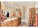 Well-lit bathroom with a shower-tub combo, vanity with storage, and neutral tones creating a serene space at 10017 Courtney Palms Blvd # 301, Tampa, FL 33619