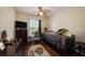 Comfortable bedroom with hardwood floors, ceiling fan, and a window offering natural light creating a relaxing atmosphere at 10017 Courtney Palms Blvd # 301, Tampa, FL 33619