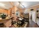 Open dining area showcases hardwood floors and an adjacent breakfast bar at 10017 Courtney Palms Blvd # 301, Tampa, FL 33619