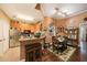 Kitchen and dining area with stainless appliances, hardwood floors, and ample counter space at 10017 Courtney Palms Blvd # 301, Tampa, FL 33619