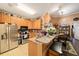 The kitchen features stainless steel appliances, ample cabinet space and barstool seating at 10017 Courtney Palms Blvd # 301, Tampa, FL 33619