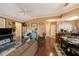 Spacious living room with hardwood floors flowing into the dining area and kitchen at 10017 Courtney Palms Blvd # 301, Tampa, FL 33619