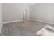 Neutral bedroom with light gray walls, wood floors, and a high ceiling at 102 Old Mill Pond Rd, Palm Harbor, FL 34683