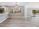 Open dining area filled with natural light and sliding door access to the patio at 102 Old Mill Pond Rd, Palm Harbor, FL 34683
