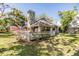 Exterior shot of the house with well-kept lawn at 102 Old Mill Pond Rd, Palm Harbor, FL 34683