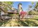 Exterior shot of the house with well-kept lawn at 102 Old Mill Pond Rd, Palm Harbor, FL 34683
