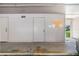 Spacious garage area with multiple storage rooms and ample parking at 102 Old Mill Pond Rd, Palm Harbor, FL 34683