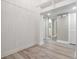 Bright hallway featuring white paneling and access to other rooms at 102 Old Mill Pond Rd, Palm Harbor, FL 34683