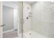 Newly renovated shower with clear glass door and sleek, modern design at 102 Old Mill Pond Rd, Palm Harbor, FL 34683