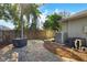 Paver patio with a covered grill in a fenced backyard at 10632 Weybridge Dr, Tampa, FL 33626