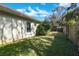 Grassy backyard featuring a well-maintained lawn and privacy fence at 10632 Weybridge Dr, Tampa, FL 33626