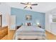 Bright main bedroom with an accent wall and ceiling fan provides a calm relaxing atmosphere at 11430 94Th St, Largo, FL 33773