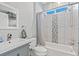 Updated bathroom features a tub with shower and updated vanity with sink and fixtures at 12227 Glencliff Cir, Tampa, FL 33626