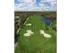Aerial view of a well-manicured golf course with water features at 12227 Glencliff Cir, Tampa, FL 33626
