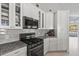 Contemporary kitchen featuring stainless steel appliances, sleek countertops, and modern cabinetry, blending style and functionality at 12227 Glencliff Cir, Tampa, FL 33626