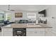 Chic kitchen featuring an island with a sink and bar seating, integrated into the living space for seamless entertaining at 12227 Glencliff Cir, Tampa, FL 33626