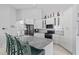Stylish kitchen boasts white cabinets, granite countertops, and stainless steel appliances, perfect for culinary enthusiasts at 12227 Glencliff Cir, Tampa, FL 33626