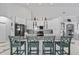 Bright and open kitchen with white cabinets, granite countertops, and a center island with barstool seating is great for entertaining at 12227 Glencliff Cir, Tampa, FL 33626