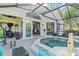 Enclosed patio features a spa and seating area at 12227 Glencliff Cir, Tampa, FL 33626