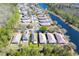 Scenic aerial view of homes located on the water with lush landscaping and meticulously maintained lawns at 12652 Chenwood Ave, Hudson, FL 34669