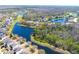 Aerial view of community with lakes and lush landscaping at 12652 Chenwood Ave, Hudson, FL 34669
