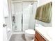 Cozy bathroom featuring a walk-in shower with glass doors and neutral decor at 12652 Chenwood Ave, Hudson, FL 34669