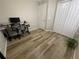 Bedroom features wood-look flooring and neutral walls at 12652 Chenwood Ave, Hudson, FL 34669