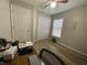 Bright bedroom featuring wood-look floors, natural light, and closet at 12652 Chenwood Ave, Hudson, FL 34669