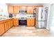 Well-equipped kitchen with stainless steel appliances, and ample cabinet space at 12652 Chenwood Ave, Hudson, FL 34669