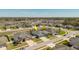 Overhead view of neighborhood featuring a lovely home with a two-car garage and well-kept landscaping at 12749 Weatherstone Dr, Spring Hill, FL 34609