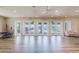 Bright and airy community room with wood floors, large windows, and cozy furniture at 12749 Weatherstone Dr, Spring Hill, FL 34609