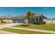 Charming single-story home featuring a two-car garage, well-manicured lawn, and beautiful landscaping in a tranquil neighborhood at 12749 Weatherstone Dr, Spring Hill, FL 34609
