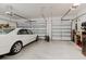 Spacious three car garage with white car at 12749 Weatherstone Dr, Spring Hill, FL 34609