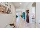 Inviting hallway featuring stylish wood-look tile flooring, arched doorways, and decorative accents creating a warm ambiance at 12749 Weatherstone Dr, Spring Hill, FL 34609