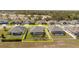 Aerial of backyard with lush lawn and screened enclosure at 12749 Weatherstone Dr, Spring Hill, FL 34609