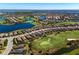 Panoramic aerial view highlighting the home's location within a golf community with ponds and mature landscaping at 12835 Sorrento Way, Bradenton, FL 34211